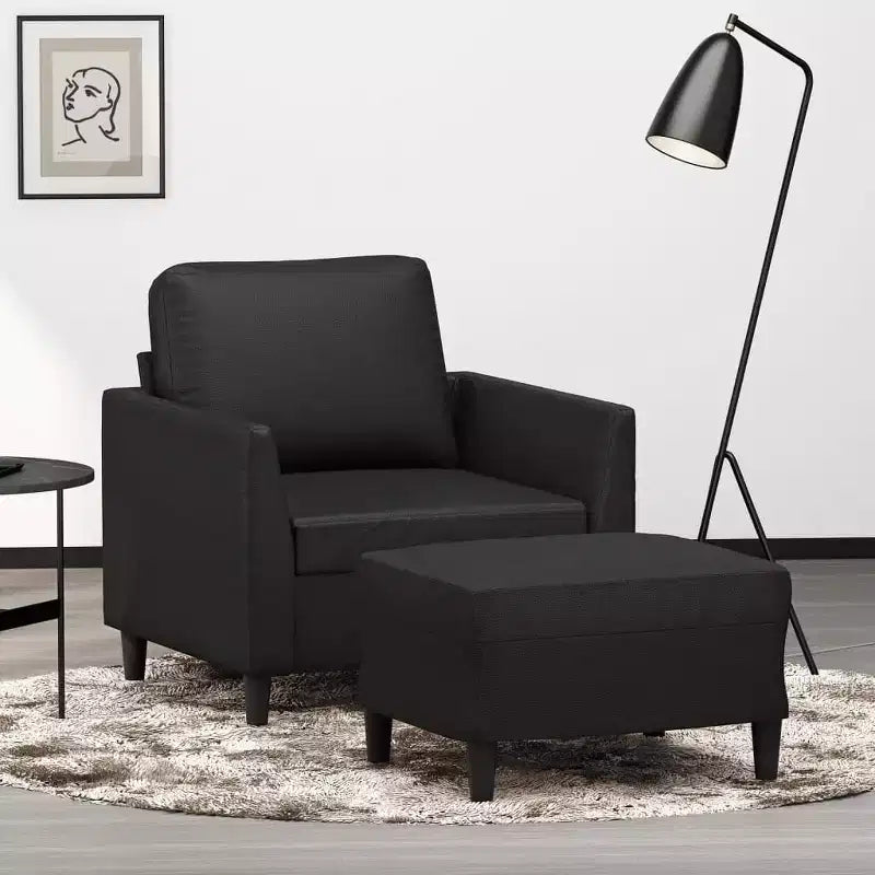 Fauteuil simple avec repose-pieds en similicuir noir